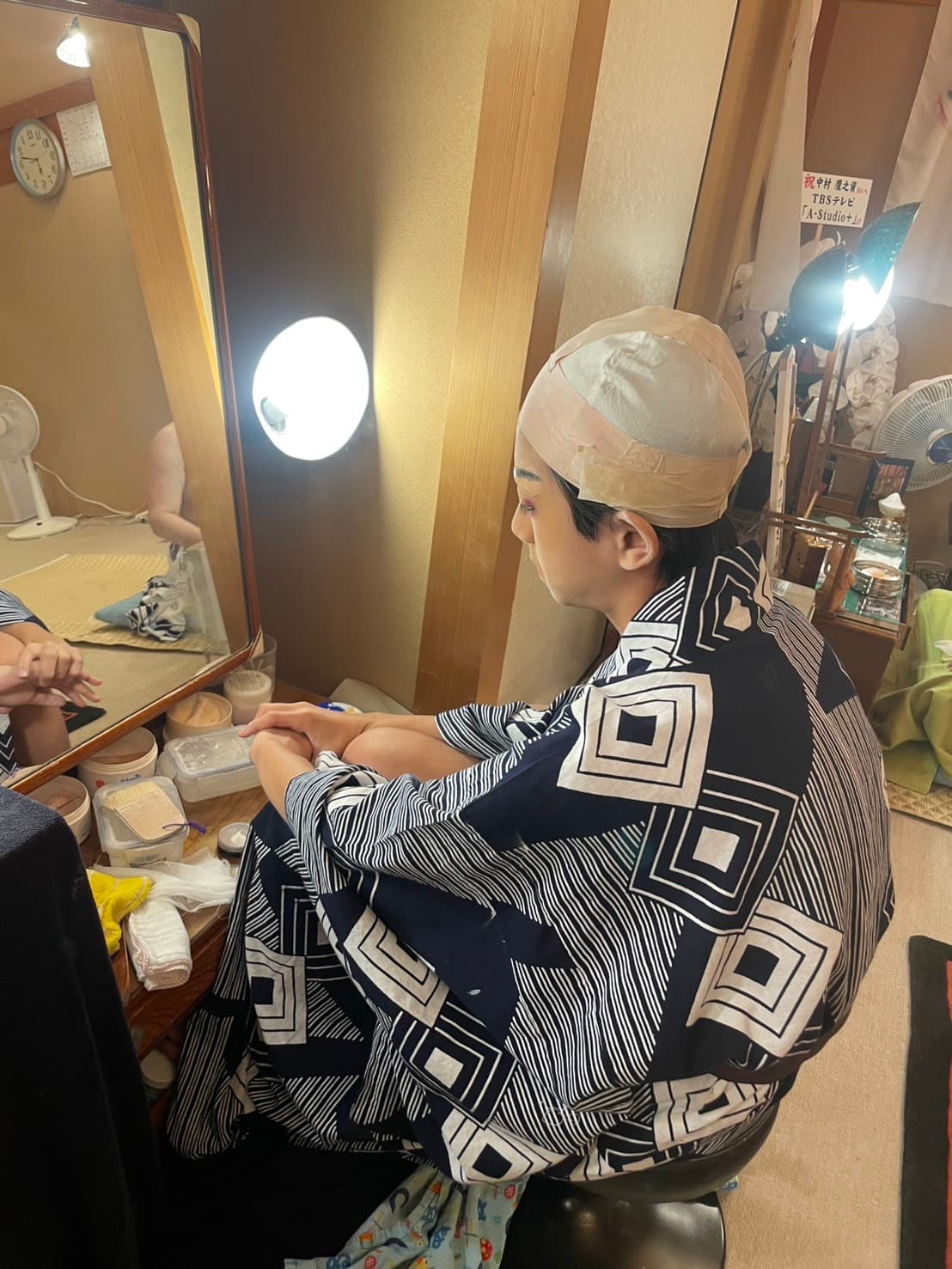 Ichikawa Shinnosuke at his dressing-room mirror
